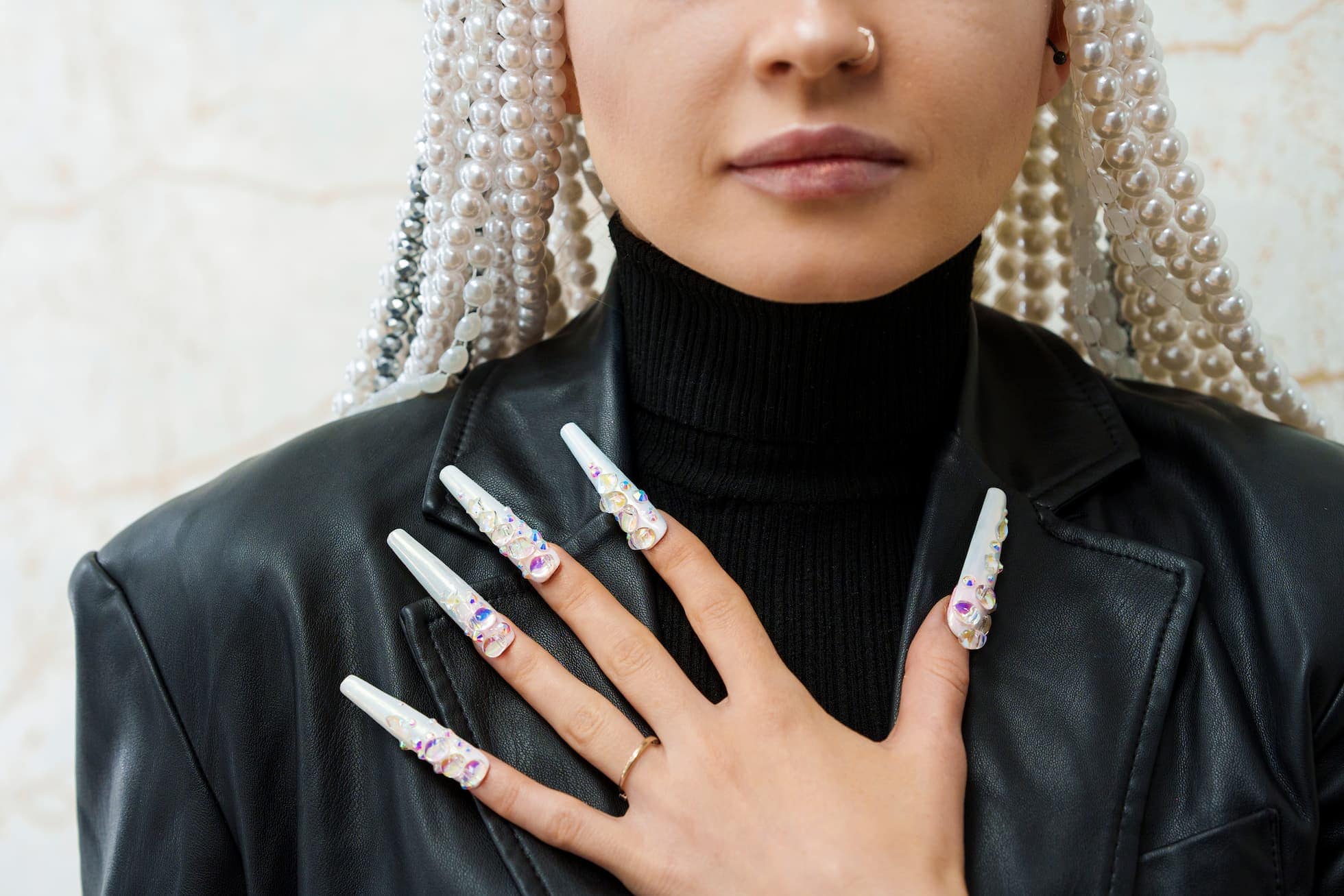 Woman showing long and decorated fake nails 2023 11 27 05 29 53 utc (1)